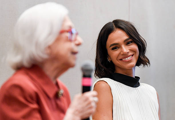 Brazilian actress Bruna Marquezine smiles as Brazilian legendary actress Fernanda Montenegro speaks during a press co...