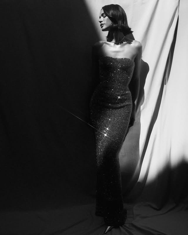 May be a black-and-white image of gown, dress and text